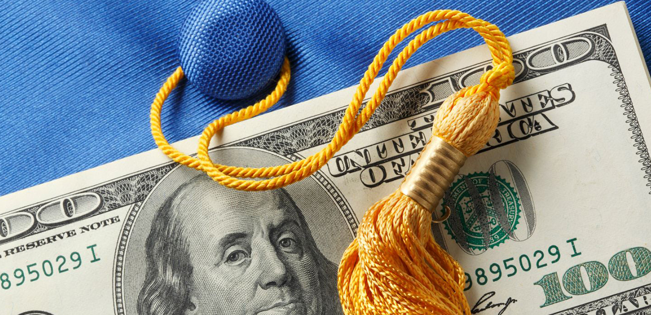Hundred dollar bill on a mortar board and tassel