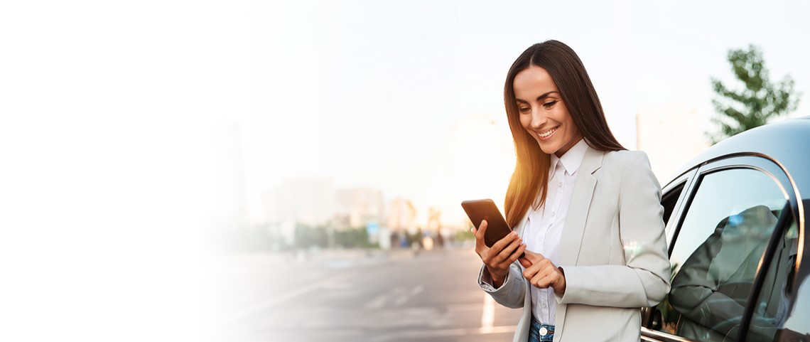 Woman with phone and car