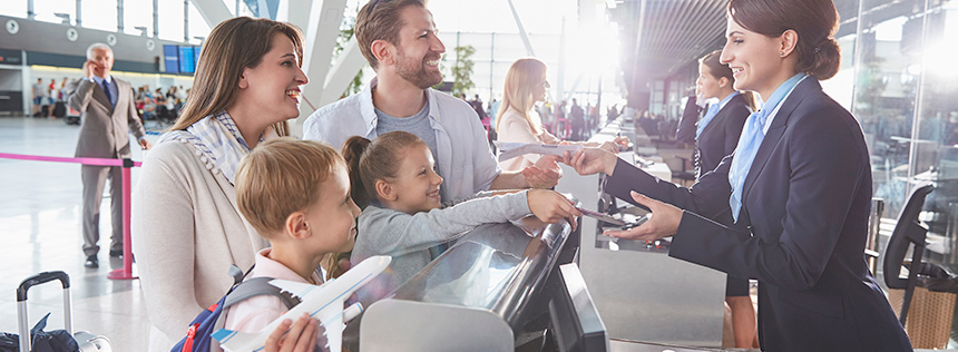 Family at airport ticket counter